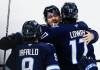 John Woods / THE CANADIAN PRESS
                                Alex Iafallo (left), Mark Scheifele and Adam Lowry celebrate Monday after Lowry&rsquo;s insurance marker against the St. Louis Blues.
