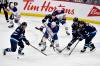 FRED GREENSLADE / THE CANADIAN PRESS
                                Edmonton Oilers&rsquo; Connor McDavid (97) passes the puck as he is surrounded by Winnipeg Jets&rsquo; Kyle Connor (81), Logan Stanley (64), Mark Scheifele (55) and Alex Iafallo (9) during the first period NHL action in Winnipeg, Sunday April 13 2025.