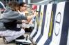 MIKAELA MACKENZIE / FREE PRESS
                                Students Athena Abuda (left) and Charisma Wozny paint a concrete barrier ahead of the whiteout street parties near Donald and Graham on Thursday.