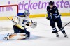 FRED GREENSLADE / THE CANADIAN PRESS FILES
                                Winnipeg Jets&rsquo; Cole Perfetti (right) looks for the rebound against St. Louis Blues goaltender Joel Hofer when the teams met in December.