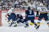 Winnipeg Jets goaltender Connor Hellebuyck (37) saves the breakaway shot from St. Louis Blues' Jordan Kyrou (25) during second period NHL playoff action in Winnipeg on Saturday. JOHN WOODS / THE CANADIAN PRESS