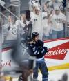 JOHN WOODS / THE CANADIAN PRESS FILES
                                Winnipeg Jets&rsquo; Jaret Anderson-Dolan (28) and Morgan Barron (36) celebrate the goal.
