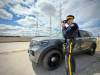 SCOTT BILLECK / FREE PRESS Sgt. R.M. Jansen, unit commander for RCMP Eastman Traffic Services in East St. Paul, demonstrates the police service&rsquo;s laser radar technology during a joint announcement with Manitoba Public Insurance on Wednesday, April 23, 2025.