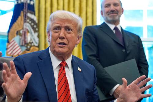 Alex Brandon / The Associated Press
                                U.S. President Donald Trump speaks as he signs executive orders in the Oval Office of the White House on April 17, as Commerce Secretary Howard Lutnick listens.
