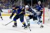 SCOTT KANE / THE ASSOCIATED PRESS
                                St. Louis Blues&rsquo; Justin Faulk and Winnipeg Jets&rsquo; Adam Lowry vie for control of the puck during the first period in St. Louis Thursday.