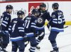 Winnipeg Jets' Dylan Samberg (54), Neal Pionk (4), Kyle Connor (81) Alex Iafallo (9) and Mark Scheifele (55) celebrate Iafallo's goal against the St. Louis Blues during third period NHL playoff action in Winnipeg on Saturday, April 19, 2025. THE CANADIAN PRESS/John Woods