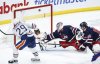 Edmonton Oilers' Leon Draisaitl (29) scores on Winnipeg Jets goaltender Connor Hellebuyck (37) as Nate Schmidt (88) defends during second period NHL action in Winnipeg on Tuesday, March 26, 2024. THE CANADIAN PRESS/John Woods