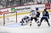 Winnipeg Jets' Adam Lowry (17) scores the game-winning goal against the St. Louis Blues' goaltender Jordan Binnington (50) in the second overtime period of NHL round one, game seven Stanley Cup playoff action in Winnipeg, Sunday, May 4, 2025. THE CANADIAN PRESS/Fred Greenslade