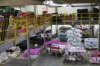 A worker organizes fabric at a textile manufacturer in Sao Paulo, Wednesday, April 9, 2025. (AP Photo/Andre Penner)