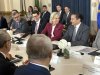 Genevieve Tuts, Ambassador of the European Union to Canada, centre, and other representatives of European Union countries met with Manitoba Premier Wab Kinew, right, at the Manitoba legislature in Winnipeg on Tuesday, April 15, 2025. THE CANADIAN PRESS/Steve Lambert