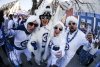 Winnipeg Jets fans Eddie, Charlene, Jenna and Erik get warmed up at the White Out Party before the Winnipeg Jets meet the St. Louis Blues in game one of NHL playoff action in Winnipeg on April 19, 2025. THE CANADIAN PRESS/John Woods
