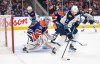 Winnipeg Jets' Gabriel Vilardi (13) picks up the rebound from Edmonton Oilers goalie Calvin Pickard (30) during third period NHL action in Edmonton on Thursday, March 20, 2025. THE CANADIAN PRESS/Jason Franson