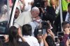 Pope Francis kisses a baby as he arrives at Commonwealth Stadium to take part in a public mass in Edmonton, Tuesday, July 26, 2022. THE CANADIAN PRESS/Nathan Denette