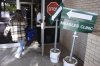 Health department staff members enter the Andrews County Health Department measles clinic carrying doses of the measles, mumps and rubella vaccine, Tuesday, April 8, 2025, in Andrews, Texas. (AP Photo/Annie Rice)
