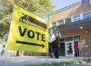 People arrive to cast their ballots on federal election day in Montreal on September 20, 2021. THE CANADIAN PRESS/Graham Hughes