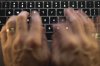 A man uses a computer keyboard in Toronto in this photo illustration. THE CANADIAN PRESS/Graeme Roy