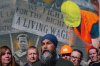 NDP Leader Jagmeet Singh speaks during a campaign stop in front of a mural commemorating the Manitoba labour movement on the side of the Union Centre building, in Winnipeg, Thursday, April 24, 2025. THE CANADIAN PRESS/Darryl Dyck