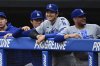Los Angeles Dodgers' Shohei Ohtani smiles in the dugout during the first inning of a baseball game against the Cleveland Guardians, Tuesday, May 27, 2025, in Cleveland. (AP Photo/David Dermer)