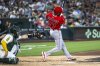 Los Angeles Angels' Tim Anderson (77) swings during the fourth inning of a baseball game against the Athletics in West Sacramento, Calif., Wednesday, May 21, 2025. (AP Photo/Nic Coury)