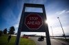 A motorist drives towards U.S. Customs and Border Protection inspection booths at the Peace Arch border crossing in Blaine, Wash., across the Canada-U.S. border from Surrey, B.C., on November 8, 2021. THE CANADIAN PRESS/Darryl Dyck