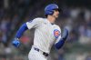 Chicago Cubs' Kyle Tucker (30) runs the bases to score on a double from designated hitter Seiya Suzuki (27) during the first inning of a baseball game against the Colorado Rockies, Wednesday, May 28, 2025, in Chicago. (AP Photo/Erin Hooley)