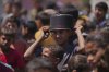 A young Palestinian waits to collect donated food at a food distribution kitchen in Deir al-Balah, Gaza Strip, Friday, May 30, 2025. (AP Photo/Abdel Kareem Hana)