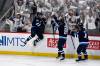 Winnipeg Jets&rsquo; Cole Perfetti (91) celebrates his goal to tie the game against the St. Louis Blues with Kyle Connor (81) and Neal Pionk (4) during third period NHL round one, game seven Stanley Cup playoff action in Winnipeg, Sunday May 4, 2025. (Fred Greenslade / The Canadian Press)