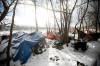 MIKAELA MACKENZIE / FREE PRESS FILES
                                An encampment along the river near Waterfront Drive in December. Encampments have started to reappear in the area.