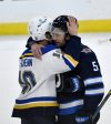 FRED GREENSLADE / THE CANADIAN PRESS FILES Winnipeg Jets&rsquo; Luke Schenn (right) embraces his younger brother Brayden Schenn after the Jets won their first-round series against the St. Louis Blues Sunday night at Canada Life Centre.