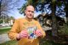 MIKE SUDOMA / FREE PRESS
                                Michael Daman holds a photo of his father who is left paralyzed after complications with West Nile virus.