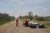 Reservist Constables Rob Collen (left) and Candice McMackin stand at a road block on Wendigo Road as fire crews continue to fight wildfires around Lac du Bonnet on Thursday. (David Lipnowski / The Canadian Press)
