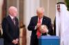 ALEX BRANDON / THE ASSOCIATED PRESS
                                U.S. President Donald Trump signs a FIFA soccer ball as Qatar&rsquo;s Emir Sheikh Tamim bin Hamad Al Thani and FIFA President Gianni Infantino look on in Doha, Qatar, on Wednesday.