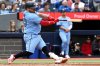 Toronto Blue Jays catcher Alejandro Kirk (30) hits an RBI double against the Athletics in fifth inning MLB baseball action in Toronto on Sunday, June 1, 2025. THE CANADIAN PRESS/Jon Blacker