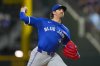 Toronto Blue Jays starting pitcher Kevin Gausman throws a pitch to the Texas Rangers during the first inning of a baseball game, Monday, May 26, 2025, in Arlington, Texas. (AP Photo/Julio Cortez)