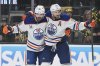 Edmonton Oilers center Leon Draisaitl (29) celebrates with teammates after scoring against the Vegas Golden Knights during the third period of Game 1 of a second-round NHL hockey playoff series Tuesday, May 6, 2025, in Las Vegas. (AP Photo/John Locher)