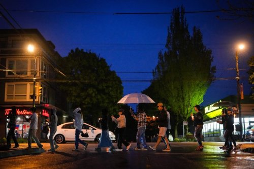 People hold a candlelight march during a vigil on the street where a vehicle-ramming attack occurred at the Filipino community's Lapu Lapu Day festival last week in Vancouver, on May 2, 2025. THE CANADIAN PRESS/Darryl Dyck