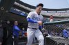 Chicago Cubs right fielder Seiya Suzuki heads to the field against the Detroit Tigers in the sixth inning during a baseball game, Saturday, June 7, 2025, in Detroit. (AP Photo/Paul Sancya)
