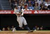 New York Yankees' Anthony Volpe hits three-run double against the Los Angeles Angels during the fourth inning of a baseball game Monday, May 26, 2025, in Anaheim, Calif. (AP Photo/Kevork Djansezian)