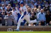 Chicago Cubs' Happ runs home to score on a double by designated hitter Seiya Suzuki (27) during the eighth inning of a baseball game against the Cincinnati Reds, Saturday, May 31, 2025, in Chicago. (AP Photo/Erin Hooley)
