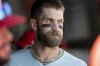 Philadelphia Phillies first baseman Bryce Harper gets ready in the dugout before a baseball game against the Athletics, Sunday, May 25, 2025, in West Sacramento, Calif. (AP Photo/Sara Nevis)