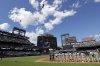 United States Army helicopters perform a flyover before a baseball game between the Chicago White Sox and the New York Mets, Monday, May 26, 2025, in New York. (AP Photo/Adam Hunger)