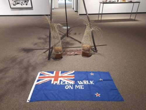 An artwork titled Flagging the Future, a cloth New Zealand flag with the words 