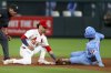 St. Louis Cardinals' Masyn Winn is late with the tag as Kansas City Royals' Maikel Garcia safely steals second during the ninth inning in the second game of a baseball doubleheader Thursday, June 5, 2025, in St. Louis. (AP Photo/Scott Kane)