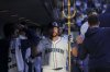 Seattle Mariners' Cal Raleigh celebrates in the dugout after hitting a solo home run during the fifth inning of a baseball game against the Washington Nationals, Tuesday, May 27, 2025, in Seattle. (AP Photo/Ryan Sun)