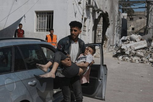 A Palestinian boy, injured following an Israeli airstrike, is brought for treatment to the Baptist Hospital in Gaza City, Friday, May 30, 2025. (AP Photo/Jehad Alshrafi)