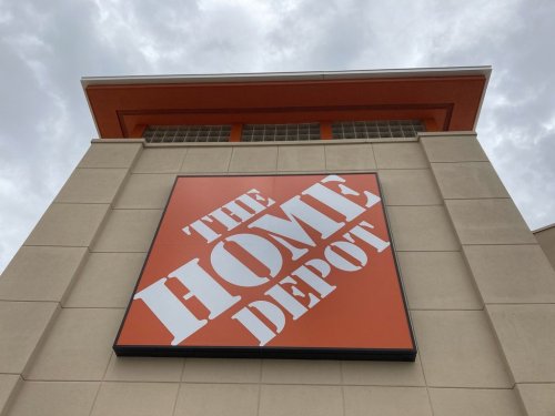 FILE - A Home Depot logo sign hands on its facade, Friday, May 14, 2021, in North Miami, Fla. (AP Photo/Wilfredo Lee, File)