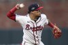 FILE - Atlanta Braves shortstop Orlando Arcia makes a throw to first base in the second inning of a baseball game against the St. Louis Cardinals, Tuesday, April 22, 2025, in Atlanta. (AP Photo/Colin Hubbard, File)
