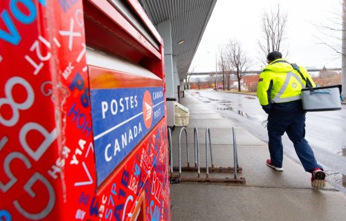 A Canada Post worker arrives for work in Montreal on Tuesday, Dec.17, 2024. Union officials are meeting with Jobs Minister Patty Hajdu in Ottawa on Friday. THE CANADIAN PRESS/Christinne Muschi
