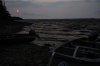 The sun sets on the shore line outside Neskantaga First Nation in Neskantaga, Ont., Saturday, Aug. 19, 2023. THE CANADIAN PRESS/Chris Young