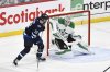 Dallas Stars goaltender Jake Oettinger (29) makes a save on Winnipeg Jets' Gabriel Vilardi (13) during first period NHL playoff hockey action in Winnipeg, Wednesday, May 7, 2025. THE CANADIAN PRESS/Fred Greenslade